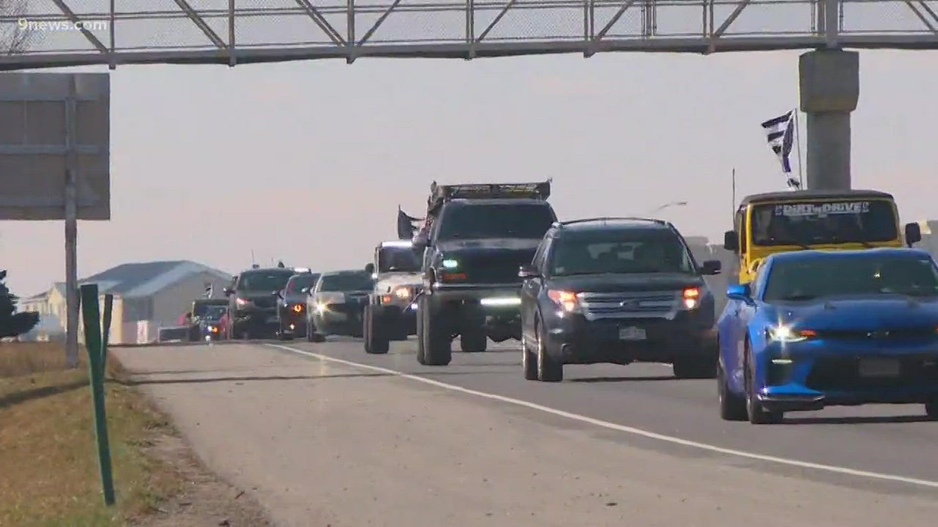 If you were driving on I-76 or US 85 Sunday morning, you may have seen their "thin blue line" flags and bumper stickers. A caravan of 4x4 vehicles and semi trucks drove from Arvada to the Colorado State Patrol office in Greeley to honor Cpl. Daniel Groves. Groves was killed during the blizzard on March 13. On Sunday, a group called 4Lo4LEO organized the drive to Greeley.