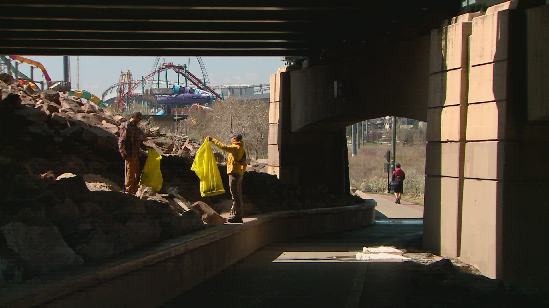 Volunteers helped pick up garbage and other debris along the South Platte River in downtown Denver Sunday.