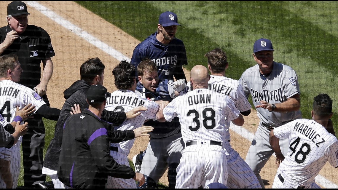 Rockies' Nolan Arenado charges mound after Padres pitcher throws