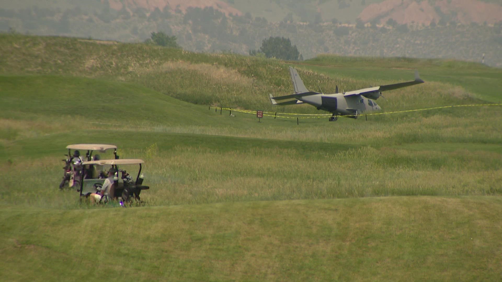The twin-engine plane carrying two people landed in Fox Hollow Golf Course on Monday. No injuries were reported.