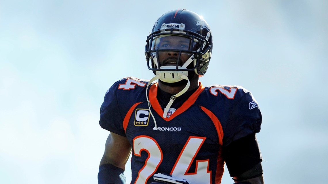 Denver Broncos CB Champ Bailey (L) hangs his head alongside