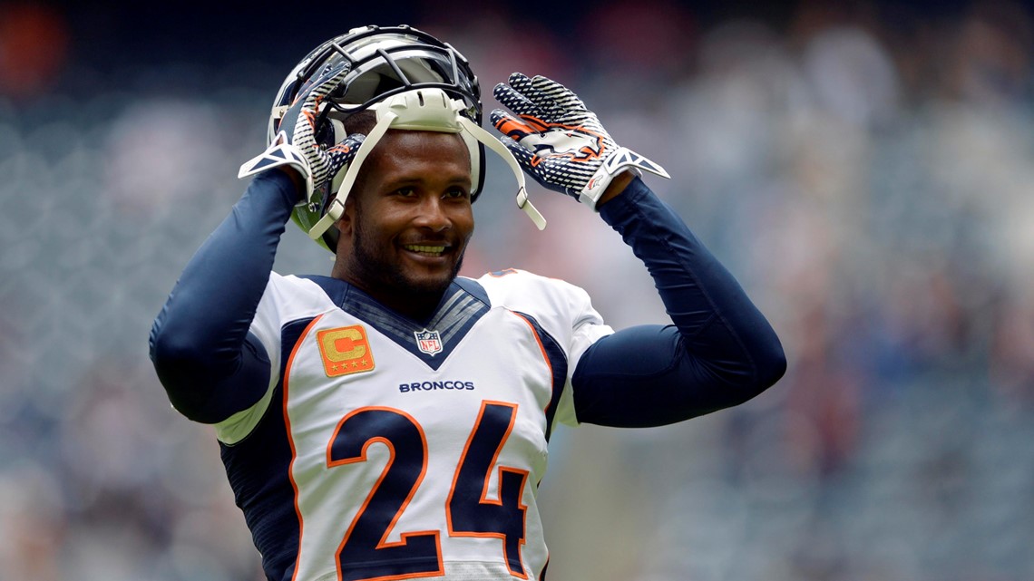 Denver Broncos defensive back Champ Bailey (L) talks with New England  Patriots quarterback during the AFC divisional playoff game at Invesco  Field in Denver onJanuary 14, 2006. Denver beat New England 27-13. (