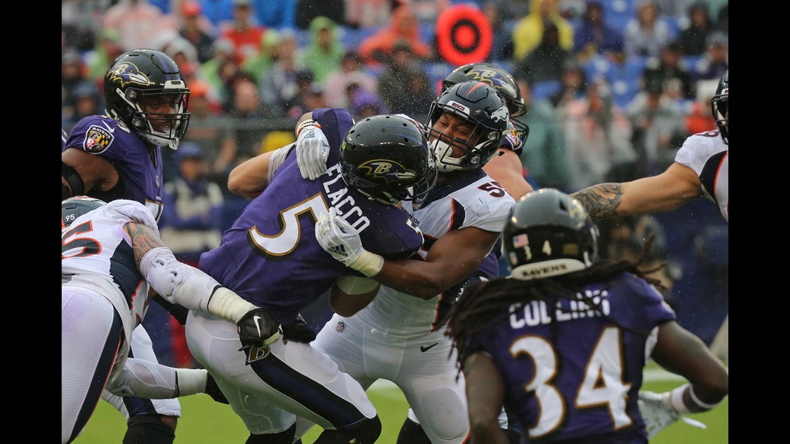 Lindsay ejected as Ravens beat Broncos, 27-14 in wild game