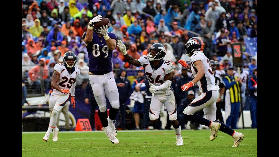 Lindsay ejected as Ravens beat Broncos, 27-14 in wild game