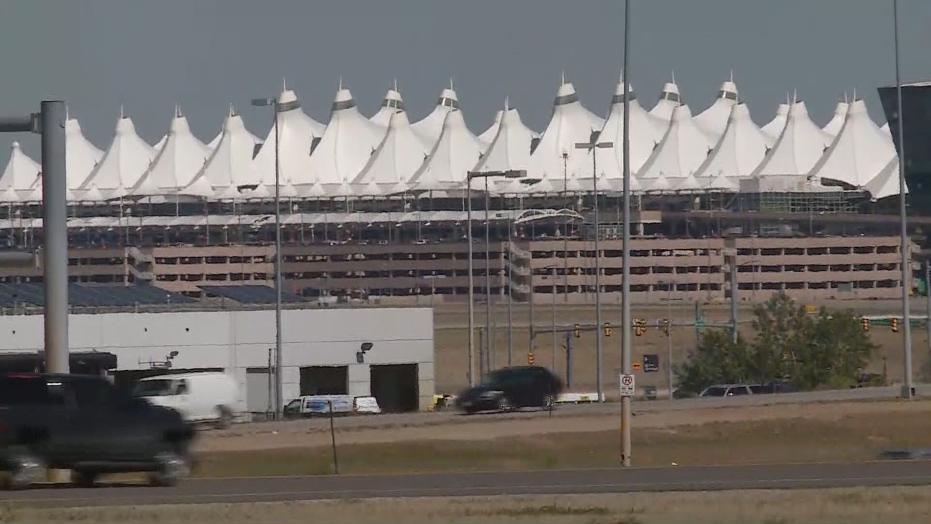 Woman carjacked at DIA's Pikes Peak Shuttle Lot | 9news.com