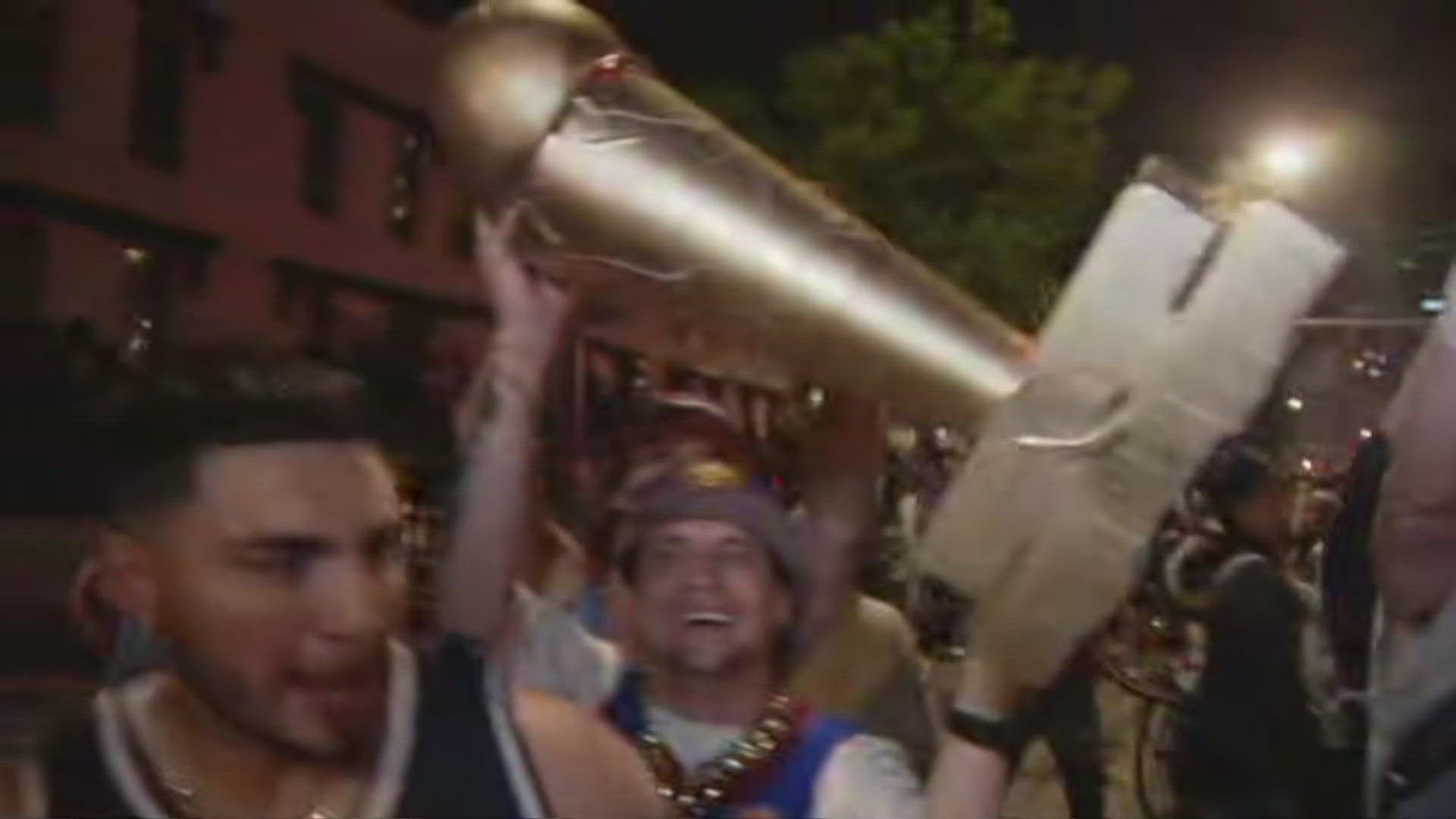 A large crowd of people gathered at 20th and Market in LoDo to celebrate the Nuggets' first-ever NBA Finals championship.