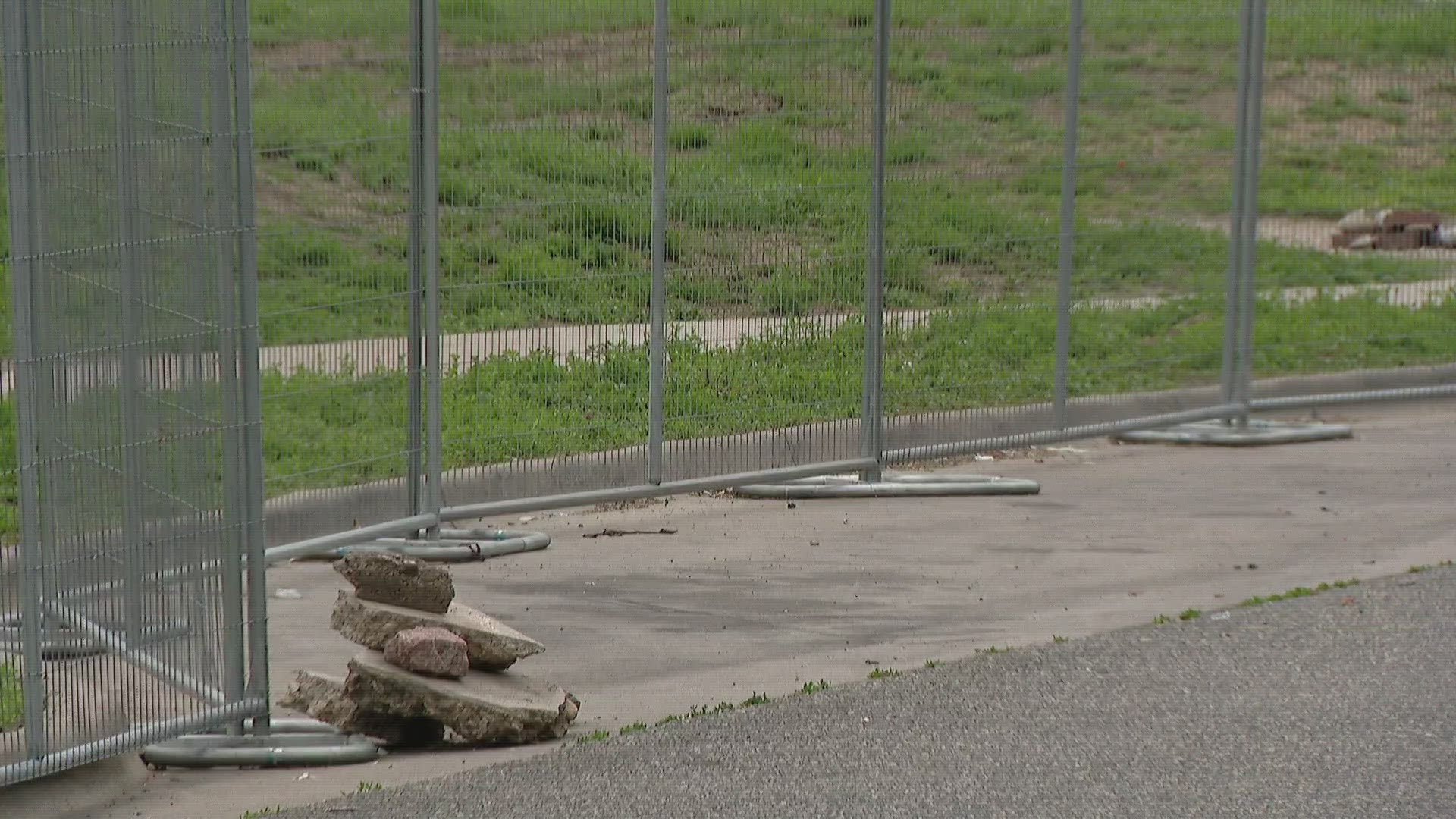Denver's Uptown neighborhood is down a sidewalk after the city put up a giant metal fence to deter encampments.