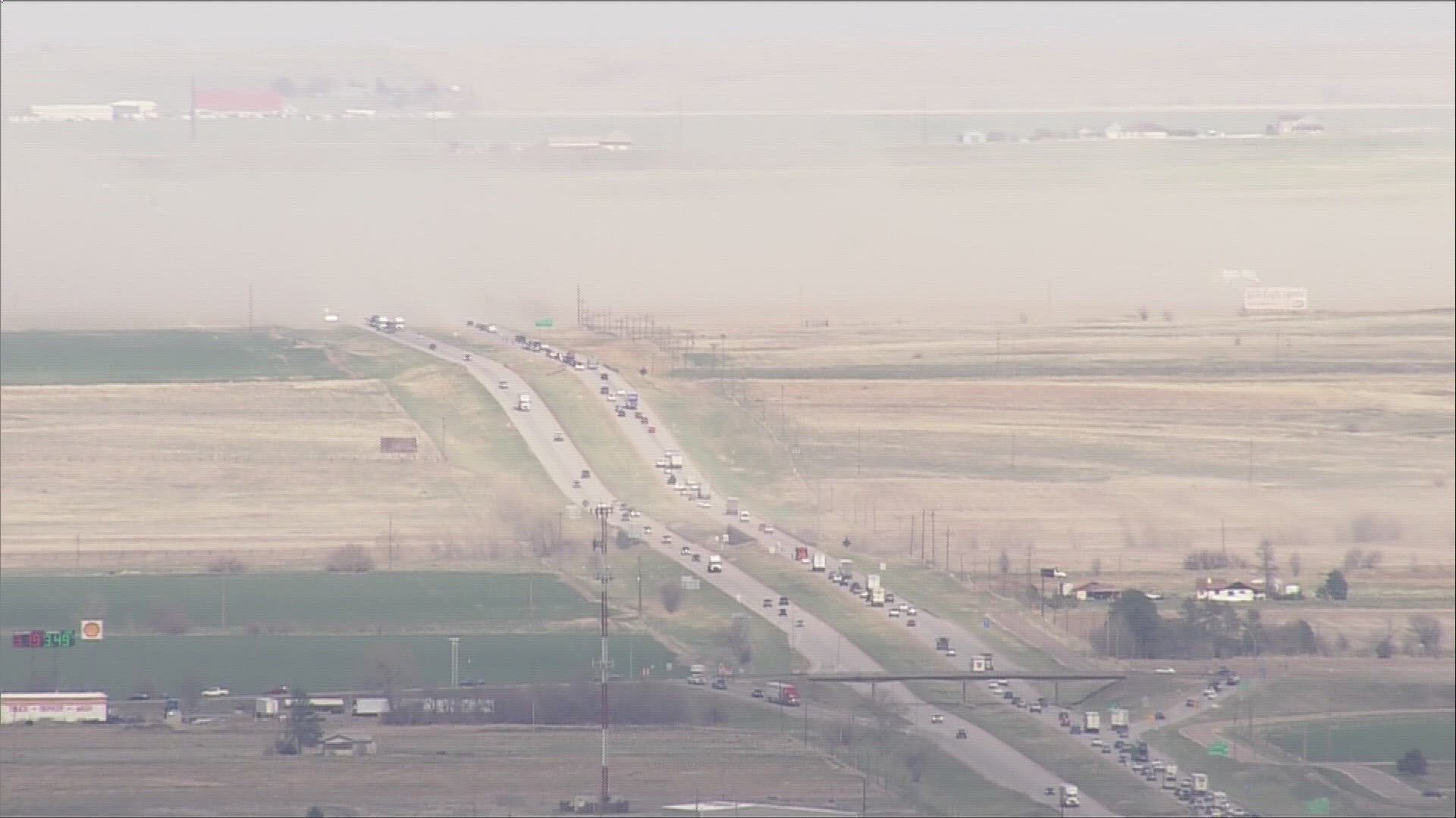 Sky9 shows a dust storm cross Interstate 70 near Bennett, east of the Denver metro area, on Friday afternoon.