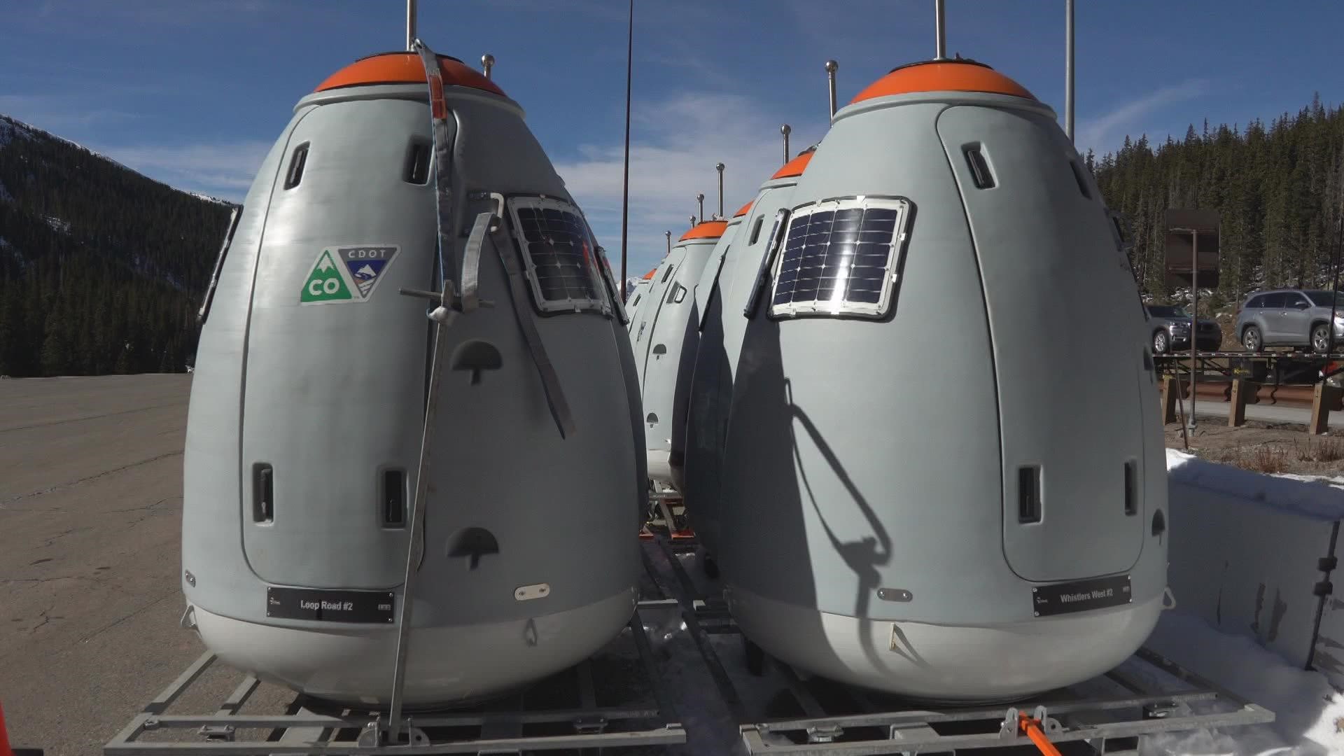 Egg-shaped devices called Gazex Exploders are in place near the Eisenhower-Johnson Tunnels and are ready to be flown to the top of the mountain for avalanche control