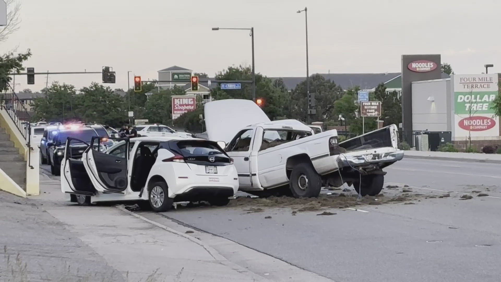 The Aurora Police Department said officers were pursuing a stolen vehicle when it crashed into a car with four people inside.