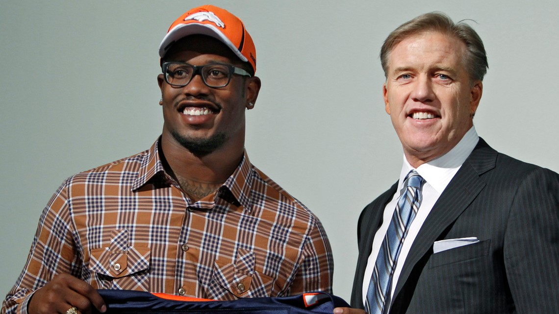 Former Colorado State offensive lineman Ty Sambrailo, the Denver Broncos  second-round pick in the NFL Draft, holds up his new jersey during a news  conference Saturday, May 2, 2015, in Englewood, Colo. (