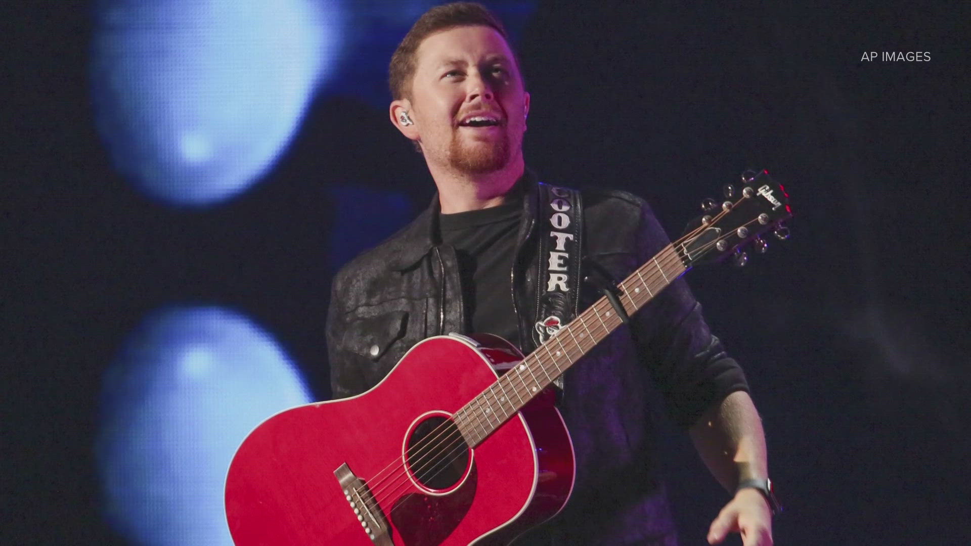 A video shared on social media shows Scotty McCreery stop mid-song to call out someone in the crowd. "That's a lady you just hit, sir," he says onstage.