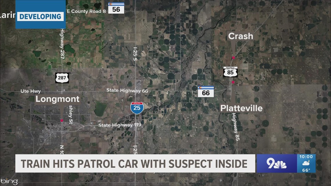 Train hits patrol car with suspect inside