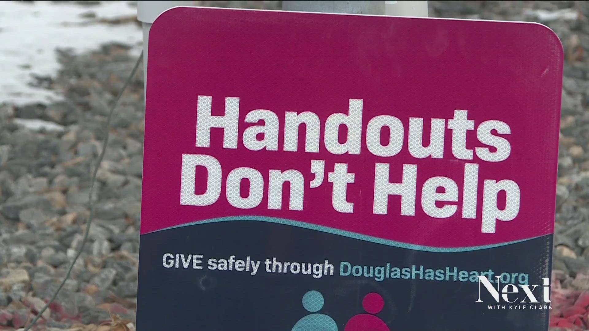 Douglas County is trying to tell people handouts don't help when it comes to those experiencing homelessness, citing public safety concerns.