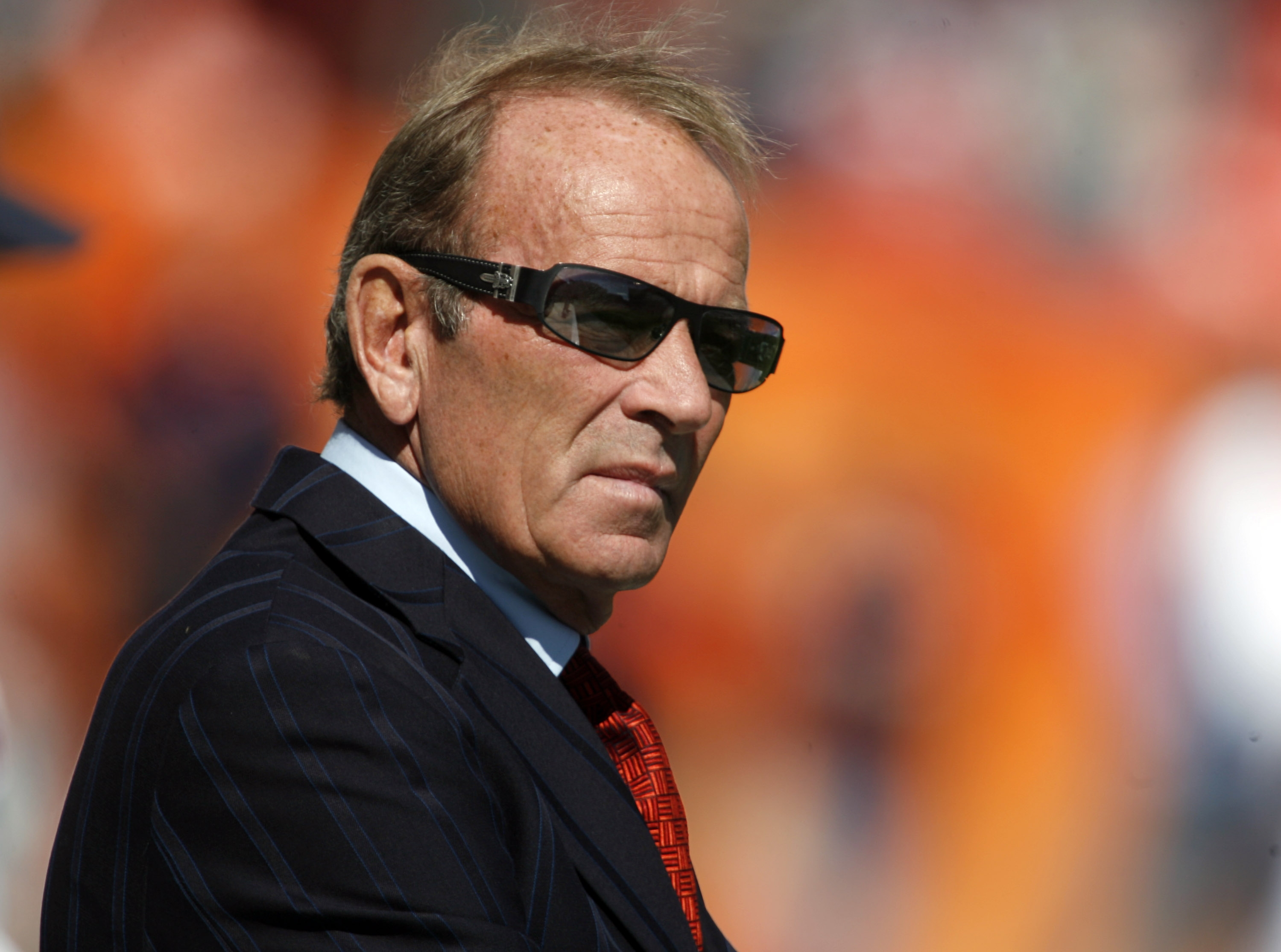 Denver Broncos Executive Vice-President of Operations John Elway speaks to  starting quarterback Peyton Manning during the final minute of play against  the Oakland Raiders at Sports Authority Field at Mile High in