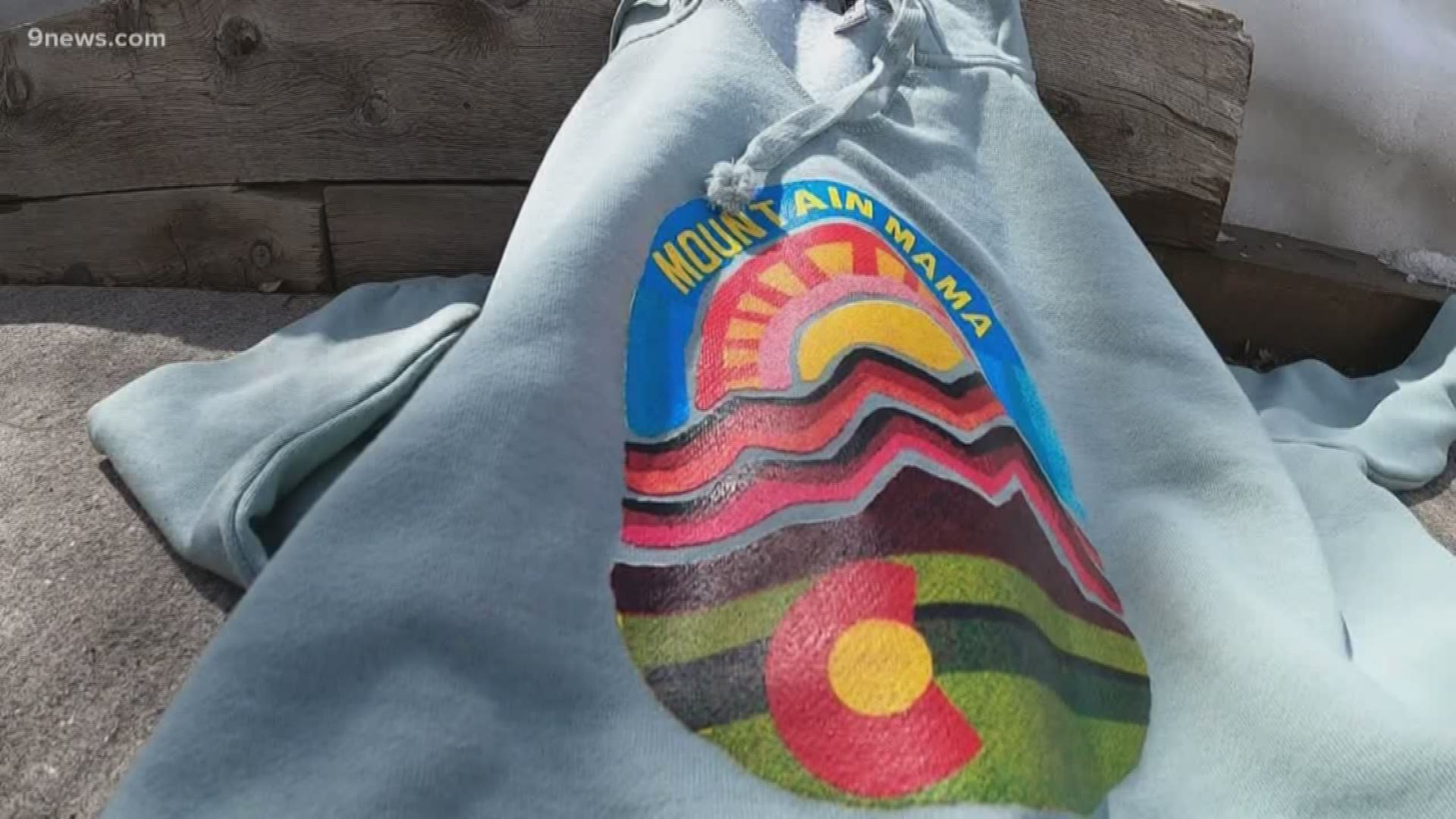 The Mountain Mama sweatshirt produced by the Sunny Side Studio gift shop in Frisco has become a COVID-19 social distancing uniform.