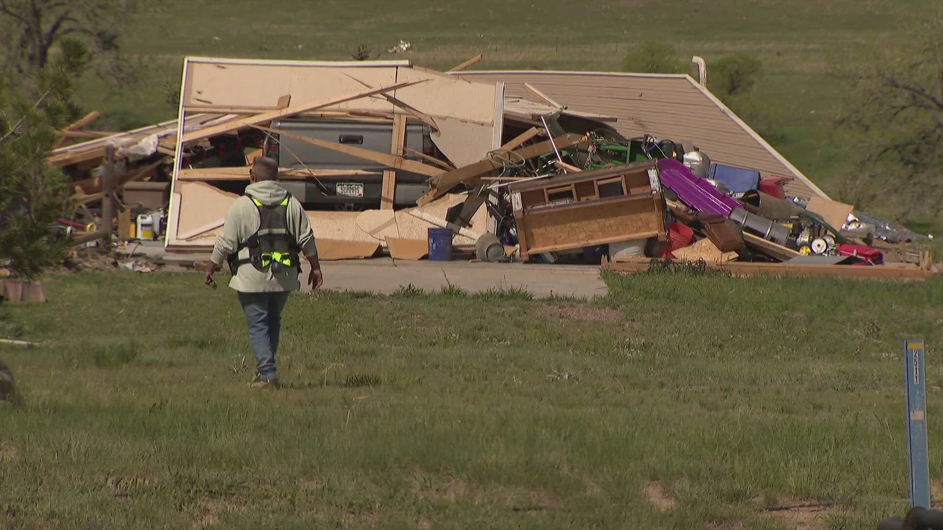 Damage and debris was scattered across yards and fields in the Elkhorn Ranch neighborhood in Elbert County after a tornado swept through the area on Sunday.