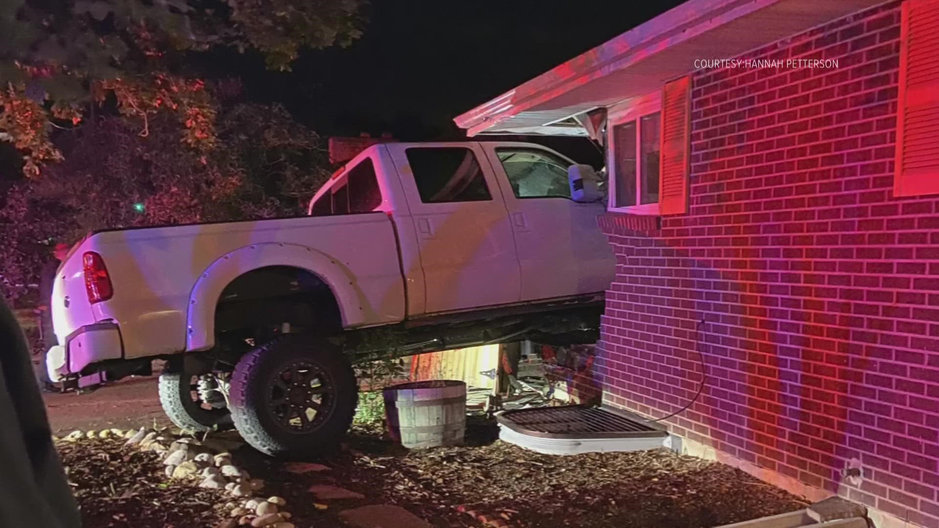 A driver with previous DUI convictions is accused of running a stop sign and crashing into a house where a family was sleeping.