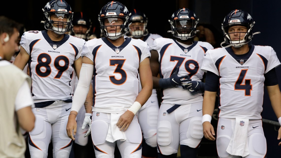 Denver Broncos' Shaun Beyer smiles while on the bench against the Seattle  Seahawks during the second half of an NFL football preseason game,  Saturday, Aug. 21, 2021, in Seattle. The Broncos won