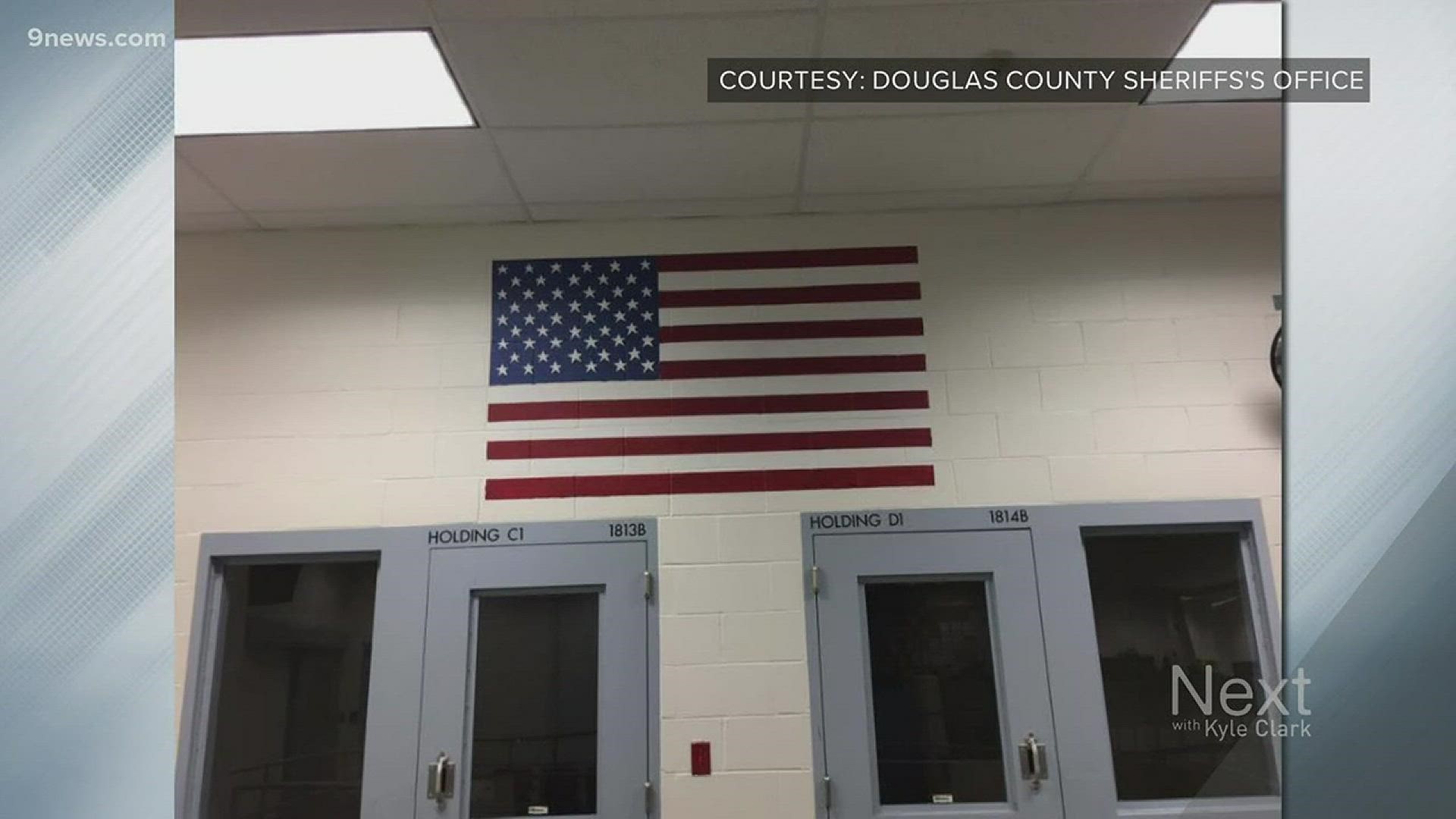 The inmate painted an american flag and a heroes flag in the jail's booking area. Captain Darren Weekly shared the photos of the inmate's art on Twitter.