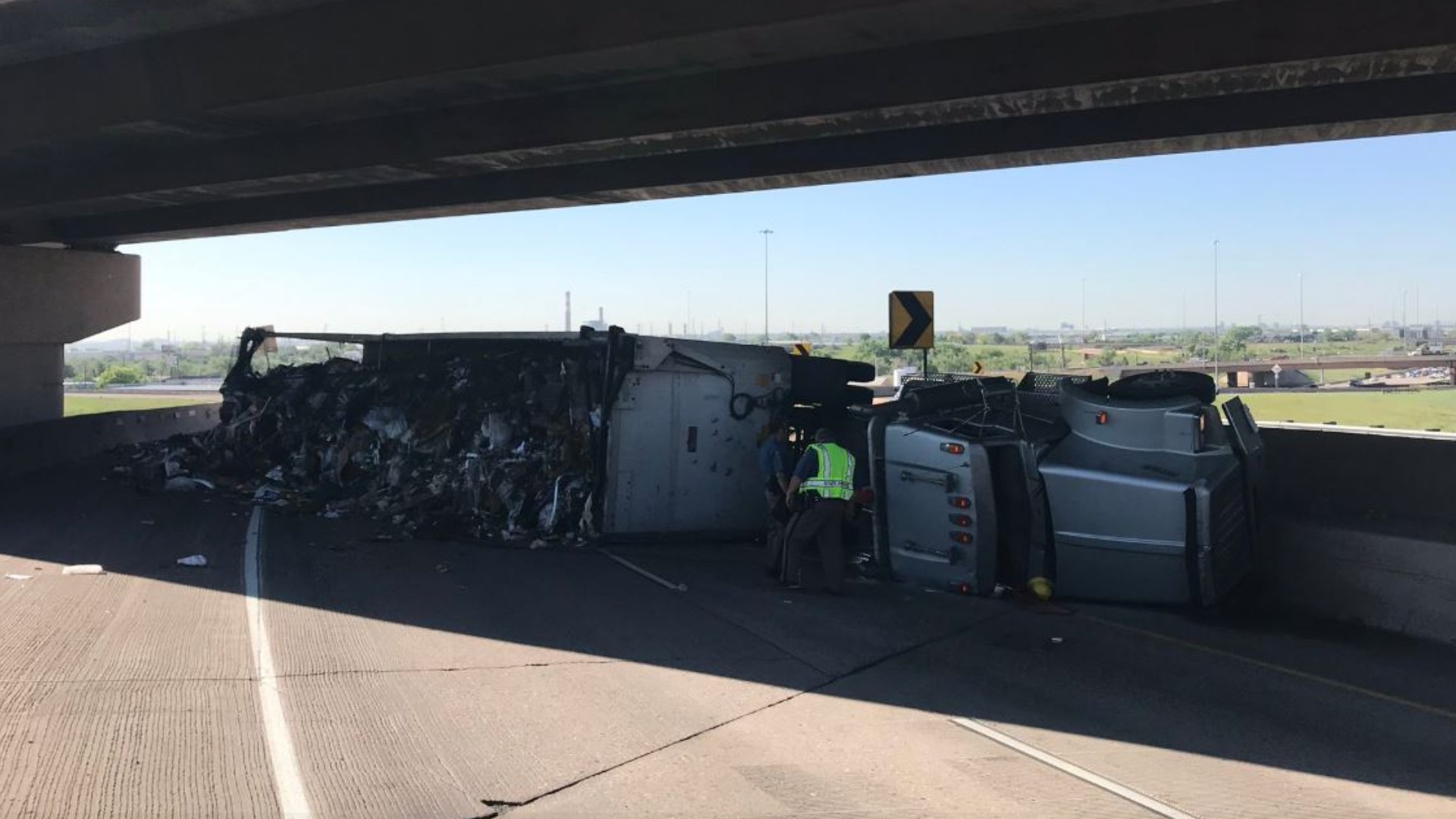 The highway was closed just past the I-25 ramp while workers removed a semi-truck that rolled over in that area.