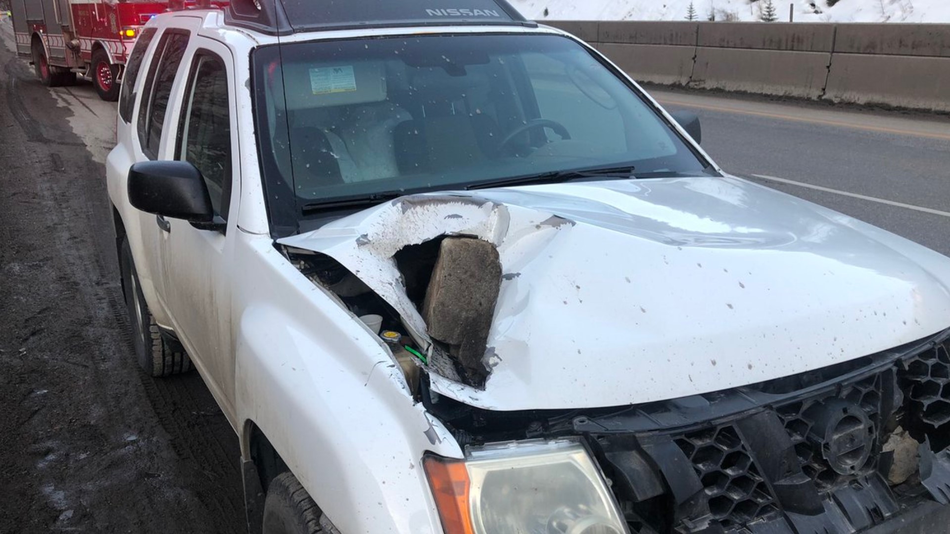 A vehicle’s front hood was hit by some of the falling rocks, but luckily, no one was injured.