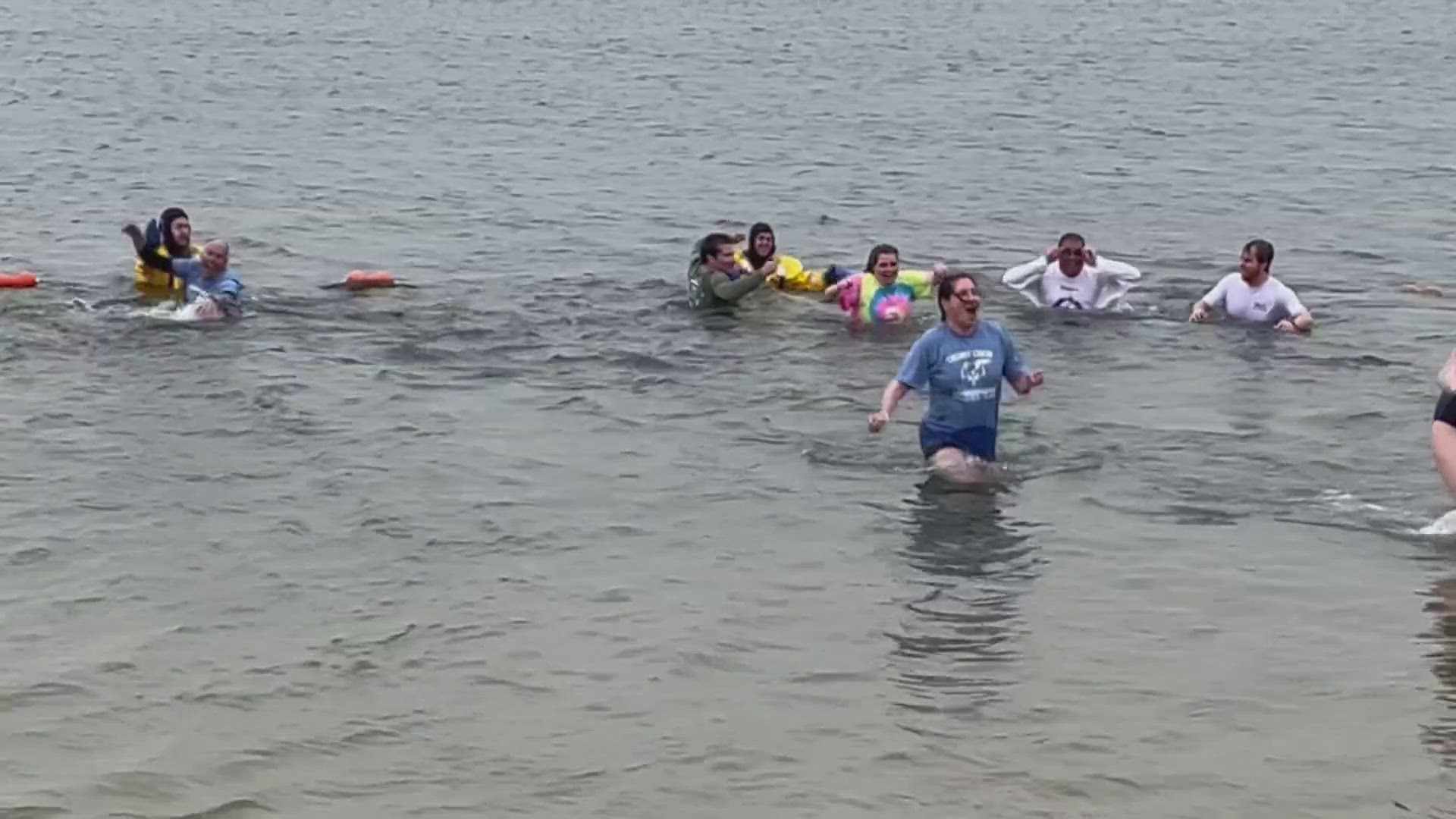 Folks were brave enough to jump into the Aurora Reservoir on Saturday before strong winds got even stronger.