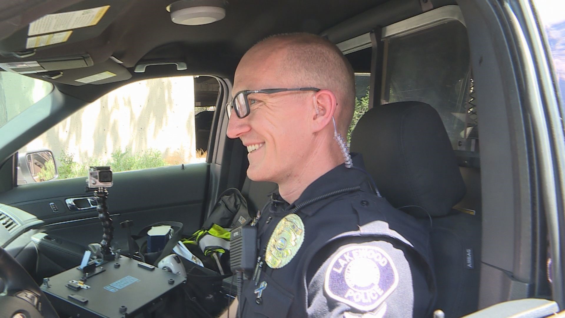 A 12-year veteran of the Lakewood Police Department broke his neck, jaw, leg and wrists in a motorcycle crash while on duty. This week, he's finally back at work.