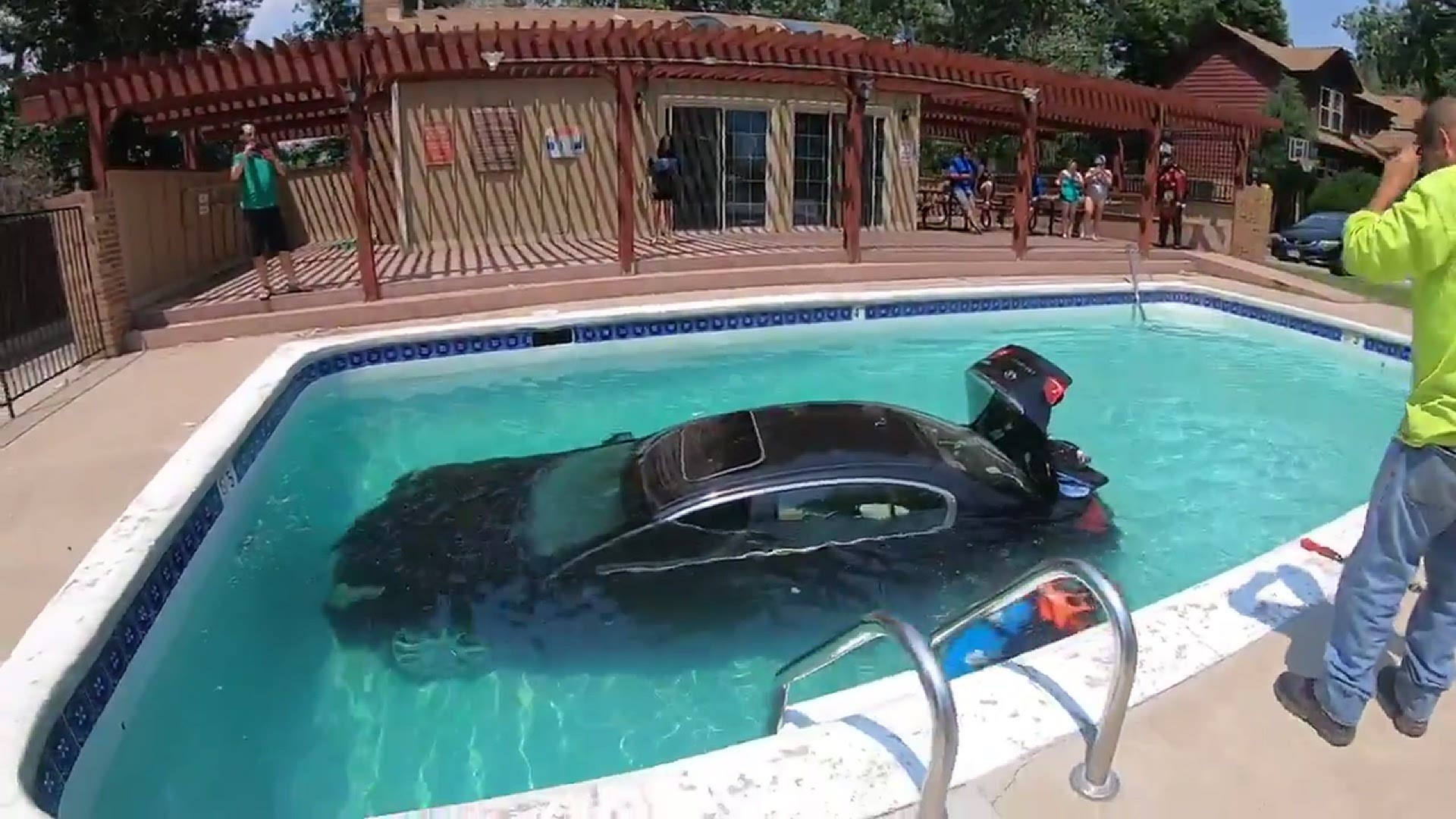 Lakewood Police said the car backed into the pool after the teen driver accidentally put it in reverse.