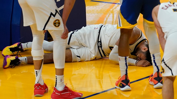 Jamal Murray helped off court after suffering apparent leg injury