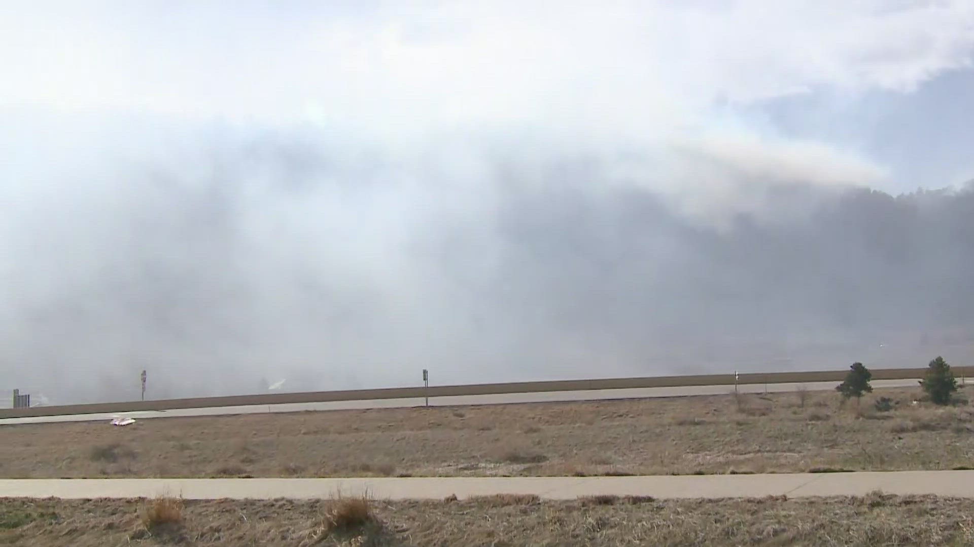 Jennifer Meckles talks to people watching the fire.