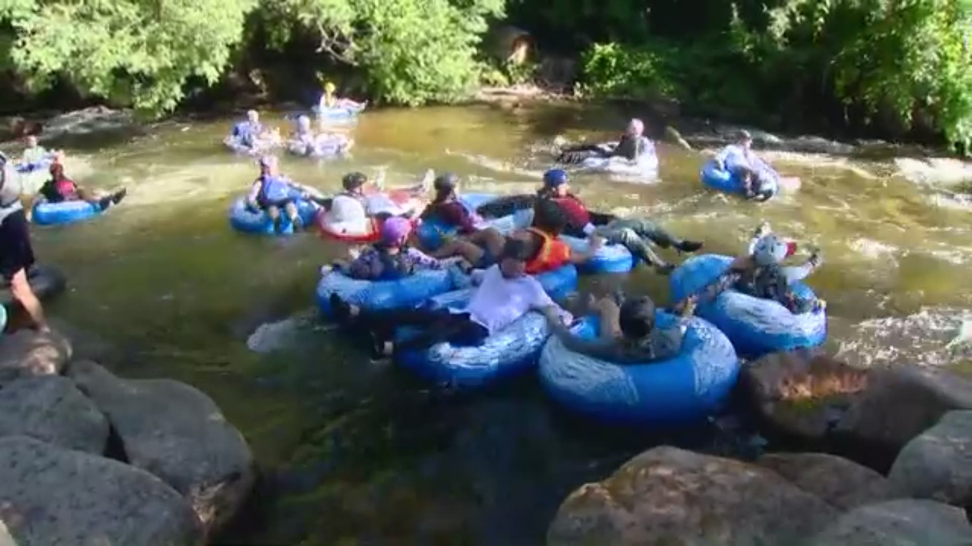 Watch as hundreds of tubers make their way down Boulder Creek for the annual Tube to Work Day!