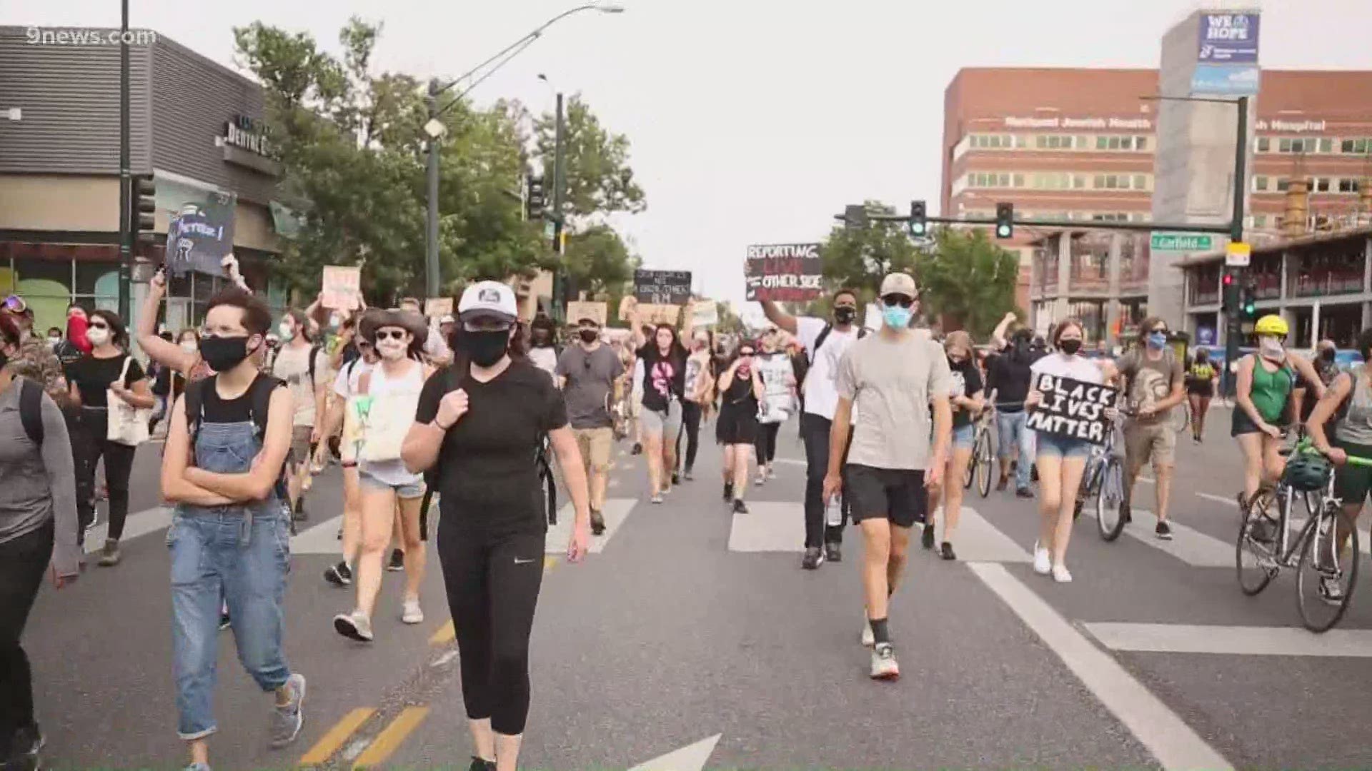 The marchers moved west on Colfax Avenue from the Martin Luther King Jr. Library in Aurora to City Park in Denver.