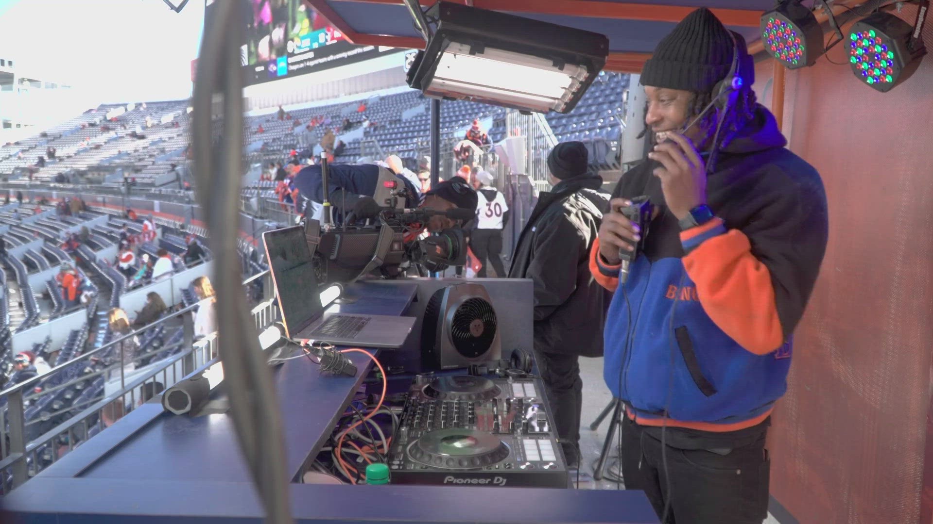 Squizzy Taylor matches moments to music for the Broncos and fans at Empower Field at Mile High.