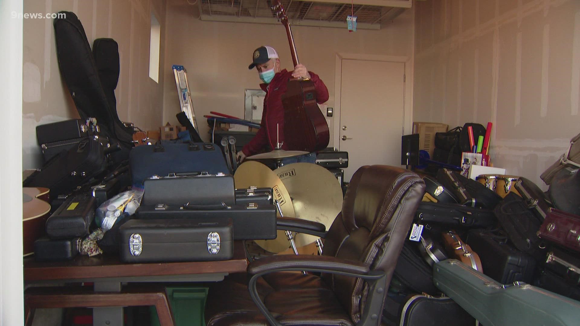 Travis Albright's neighbors have dropped off so many instruments that he ran out of space in his garage and is now storing them in his kitchen and basement.