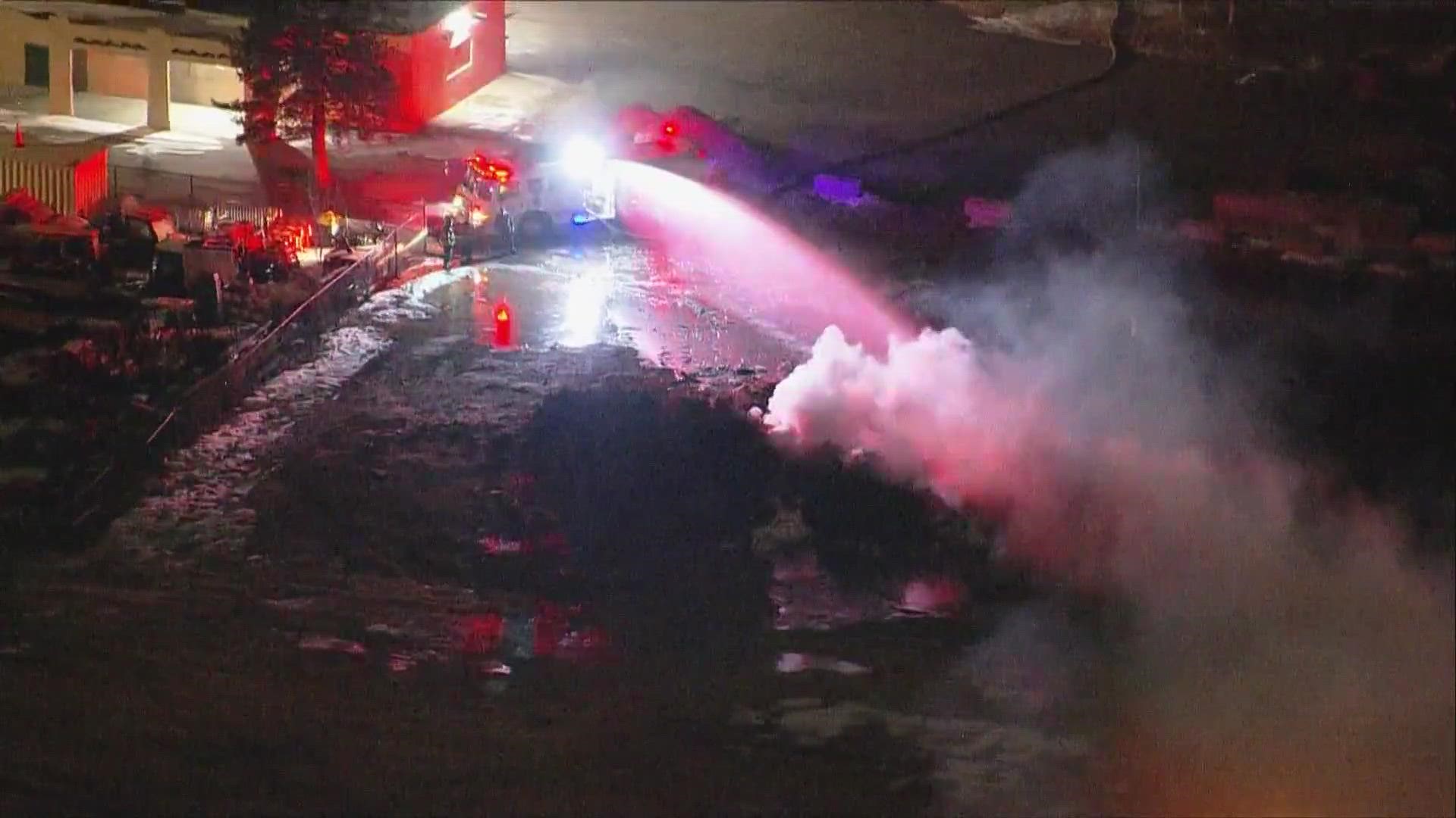 Fire crews responded to a brush fire in the parking lot at Sloan Lake in Denver.