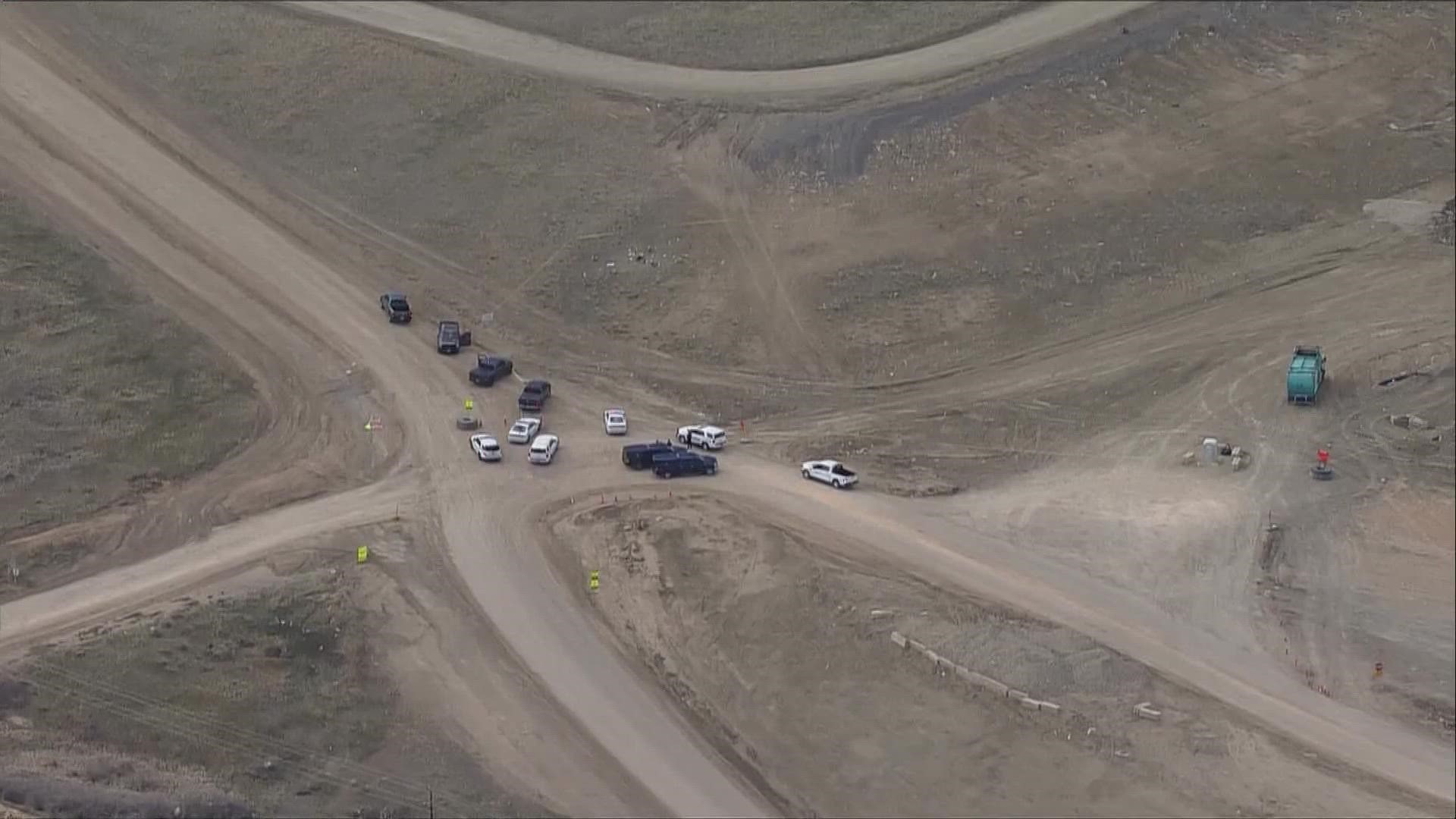 The suspect was shot at the Larimer County landfill, according to the sheriff's office. No deputies were injured.