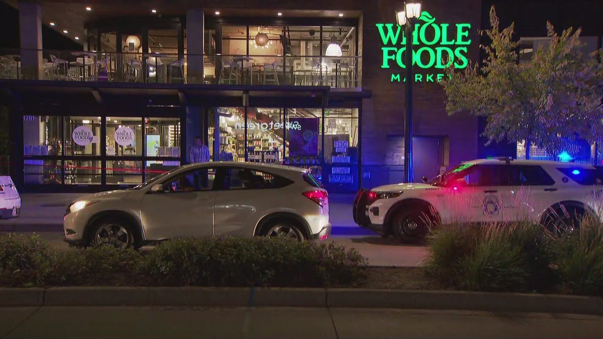 Denver Police said an officer fired a round a man brandishing a knife inside the Whole Foods located at 17th and Wewatta streets.