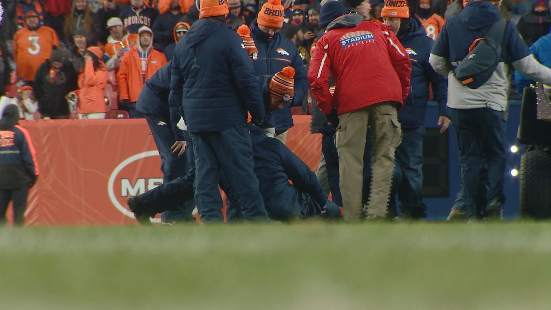 Fan Tacking Denver Broncos security guard breaks ankle tacking fan | 9news.com