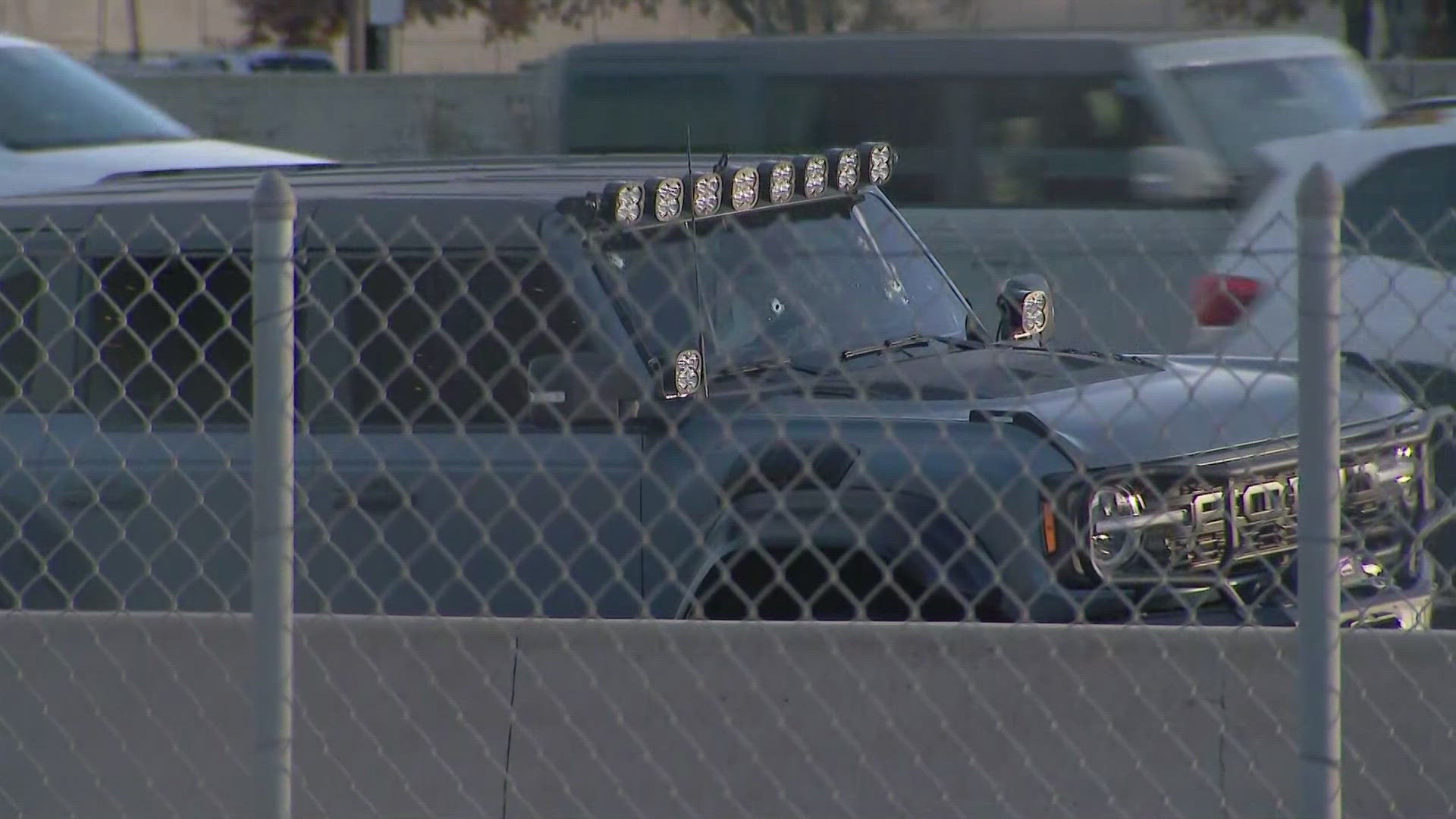 An SUV on the right shoulder of Interstate 25 that had visible holes in the windshield appears to be related to the shooting, police said.