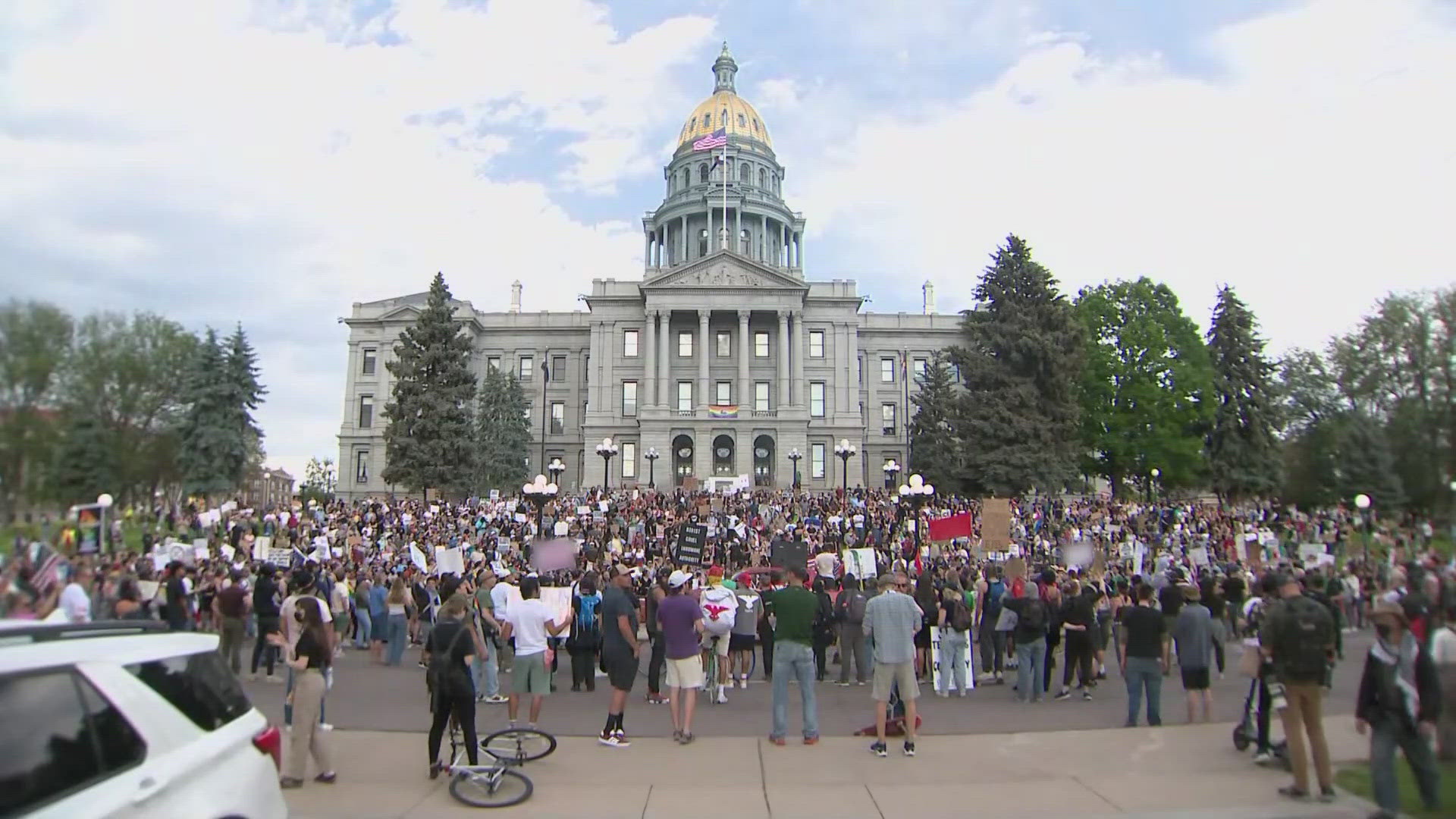 Denver Police said officers deployed smoke and pepper balls to break up crowds blocking roadways around 8 p.m. Tuesday. 
