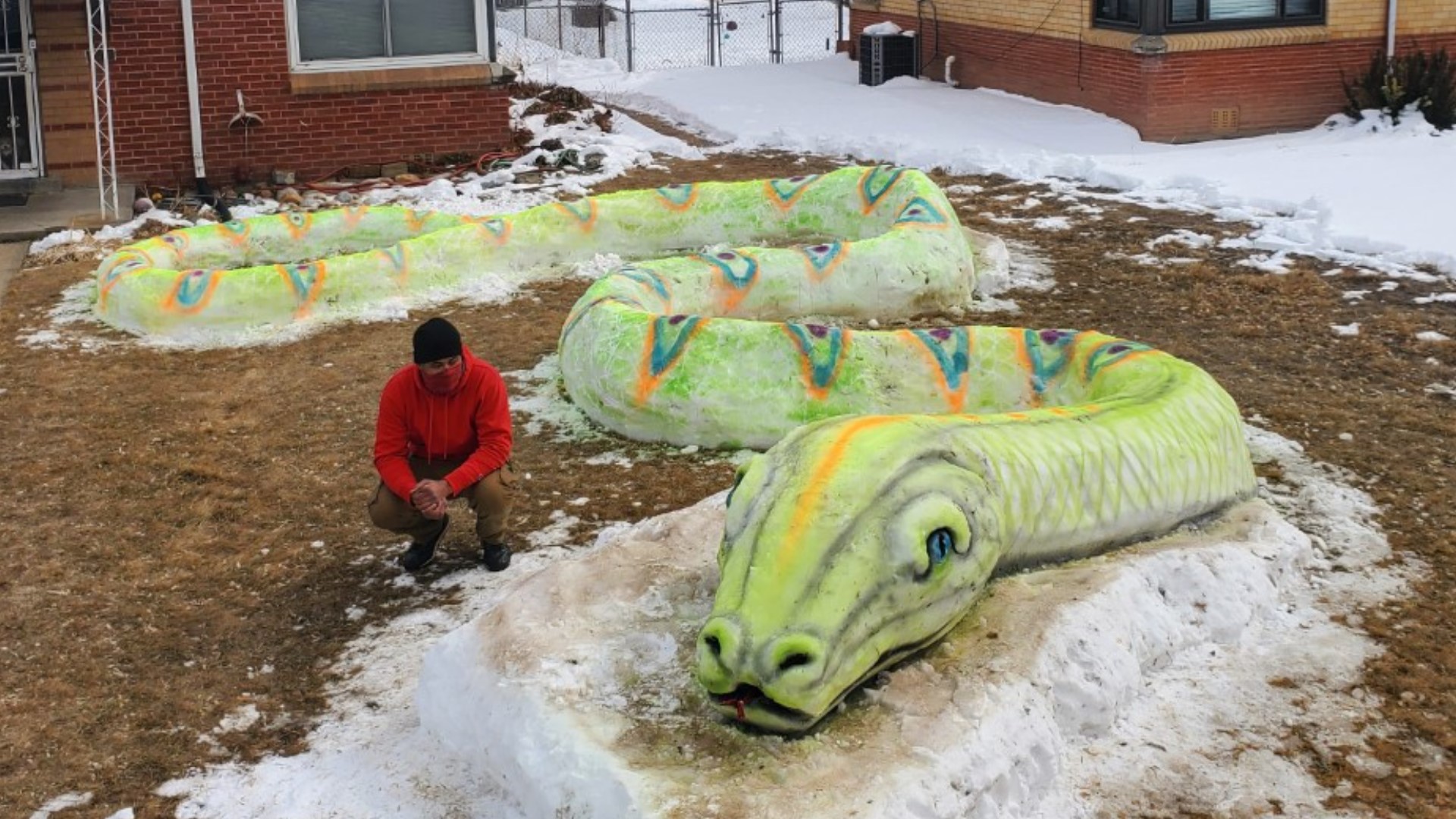 Morn Mosley and his siblings built a huge snake out of snow in Denver’s Park Hill neighborhood over the weekend.