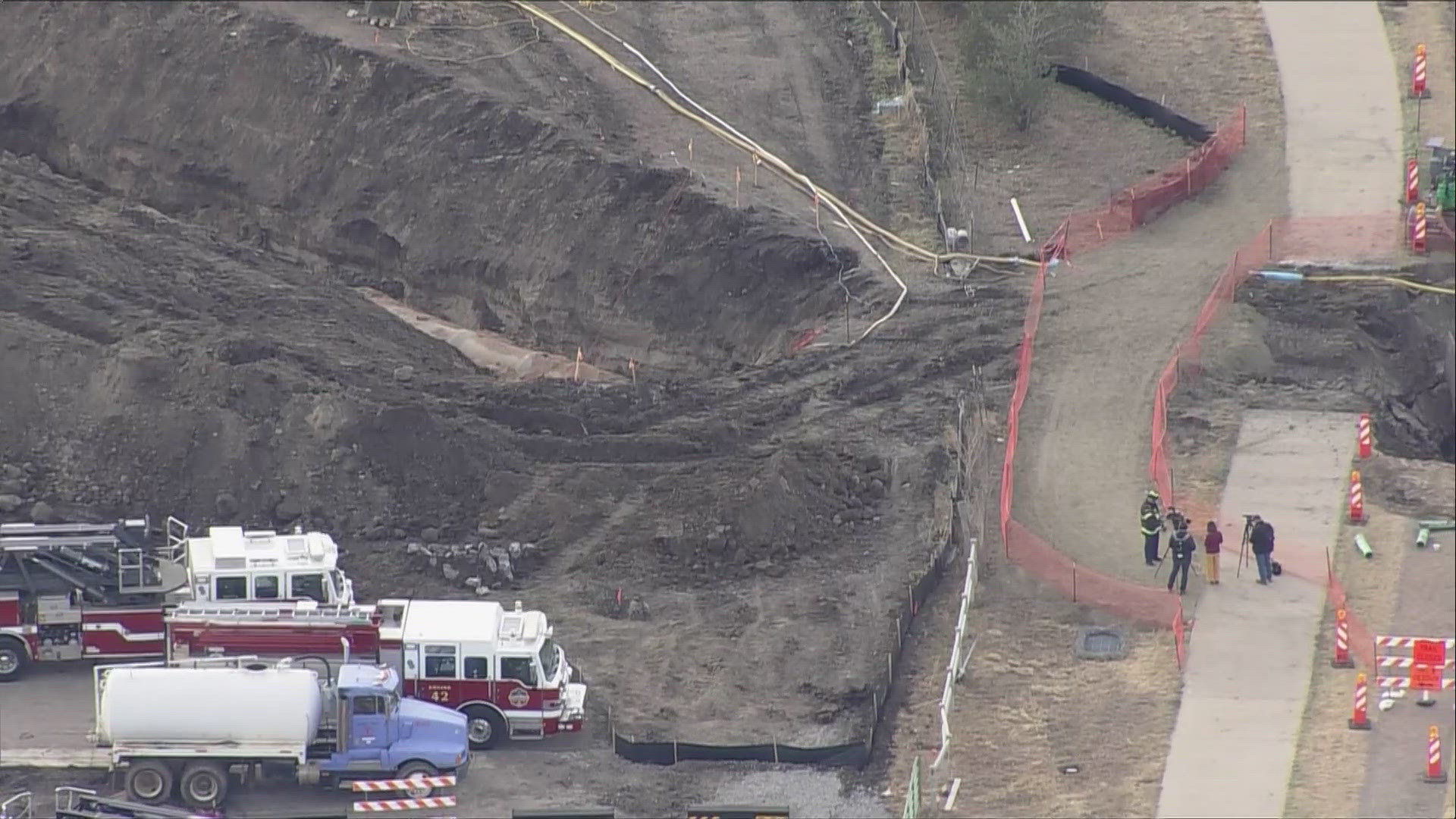 Both workers were trapped inside the trench at a construction site on the Cherry Creek Trail near South Parker Road and East Broncos Parkway.