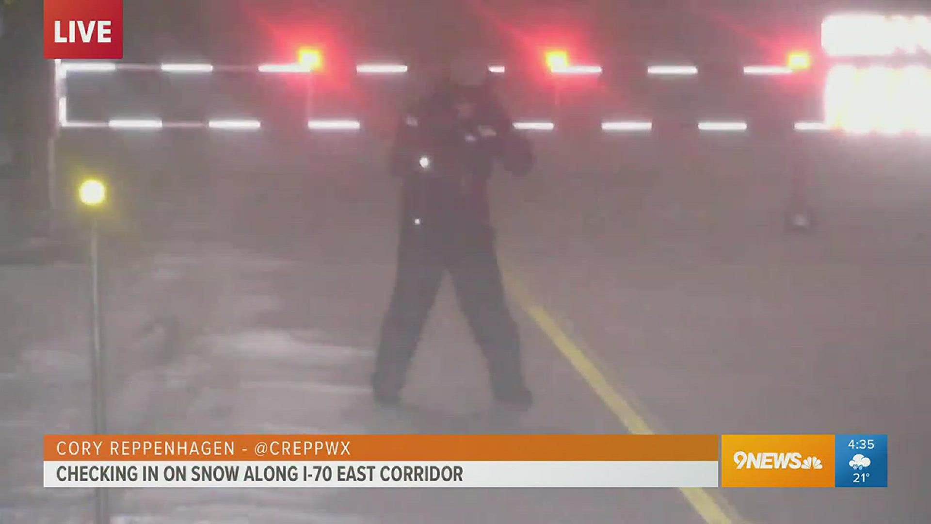 9news meteorologist Cory Reppenhagen reports live along I-70 east and almost gets blown away by the strong storms.