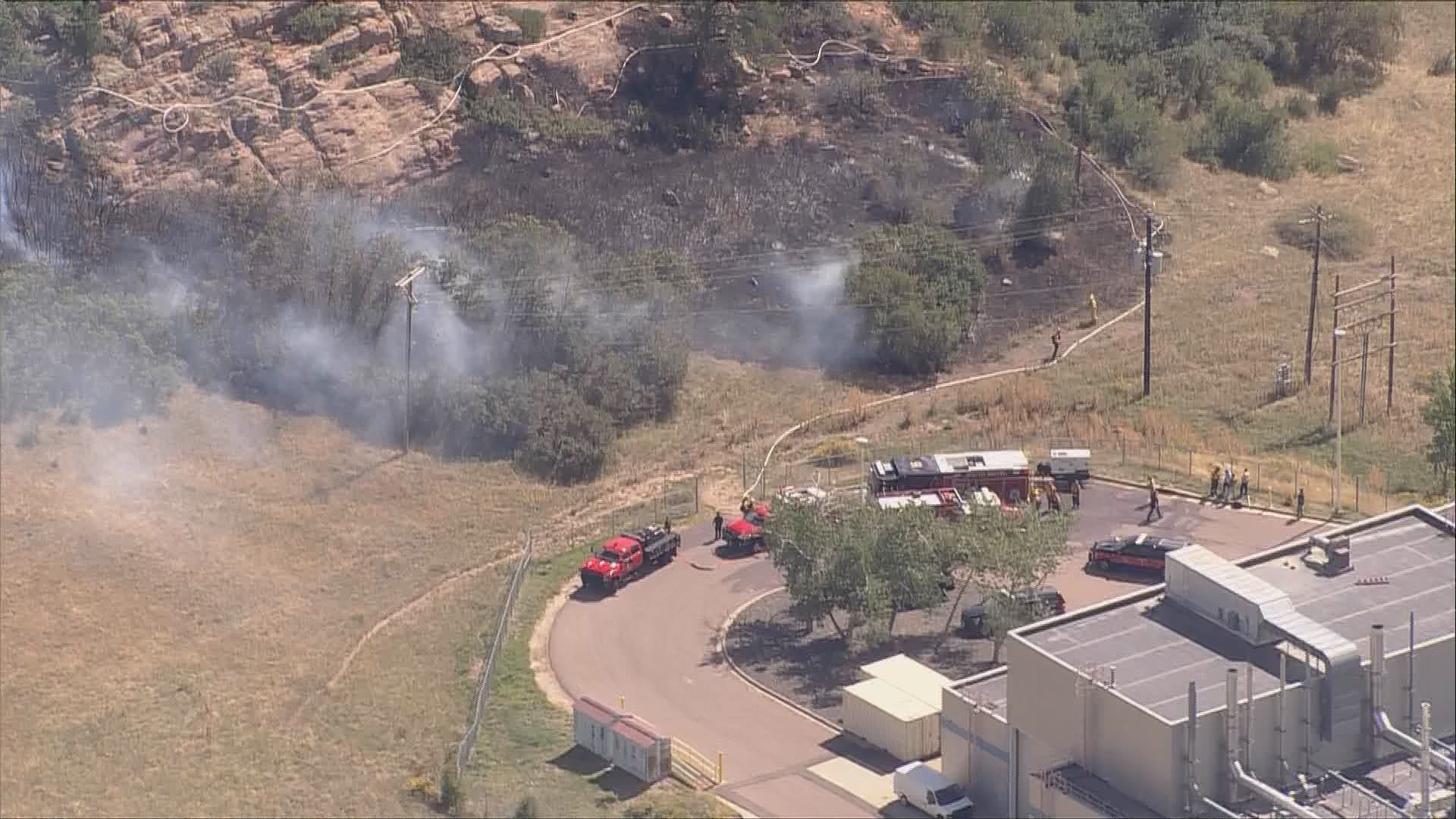 The fire was reported about 11 a.m. near 12257 S. Wadsworth Blvd. on Lockheed Martin property.