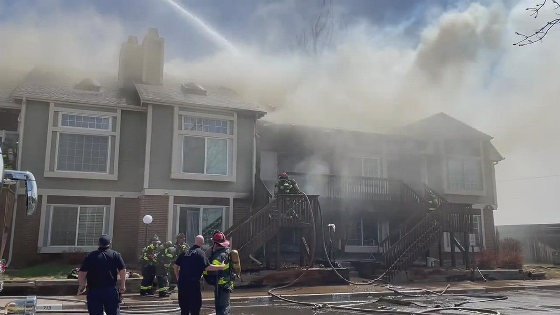 One person has been injured in a fire burning in a 2-story condo building in Denver.
