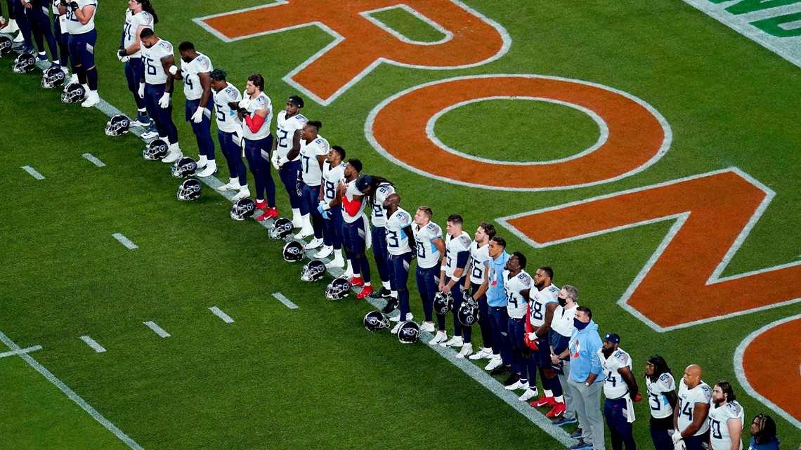 Tennessee Titans and Denver Broncos players join together in a Christmas  prayer on the 50 yard line following an NFL football game on December 25,  2004 at The Coliseum in Nashville, TN.