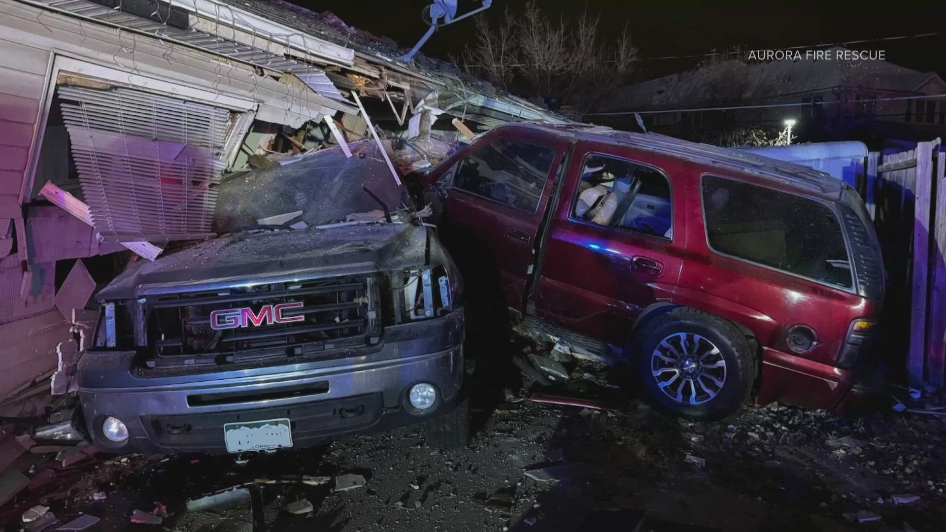 Investigators say a red SUV drove off the road, crashed into a truck and plowed into the side of the Aurora home. It severed a gas line.