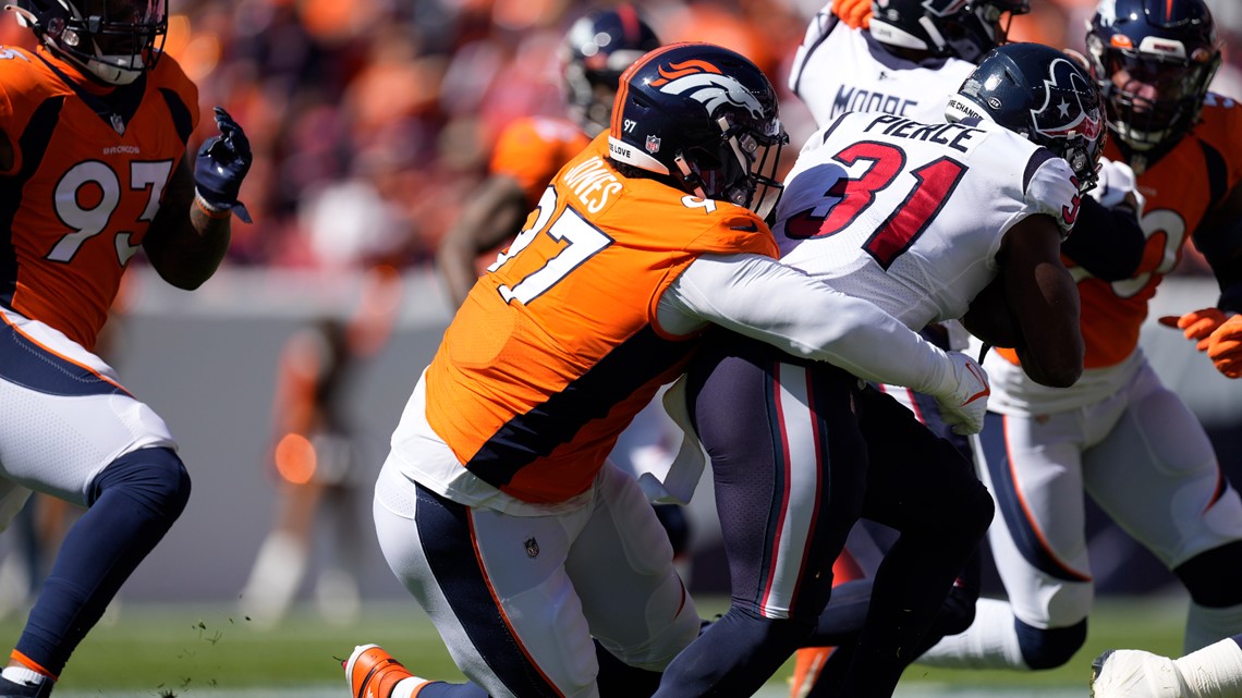 Tennessee Titans cornerback Terrance Mitchell (39) intercepts a pass by Denver  Broncos quarterback Russell Wilson during the second half of an NFL football  game Sunday, Nov. 13, 2022, in Nashville, Tenn. (AP