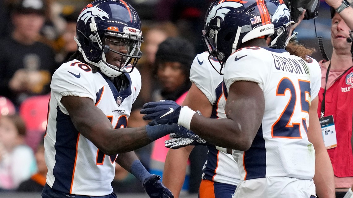 Denver Broncos orange-blue stripe uniform combo returns vs Titans